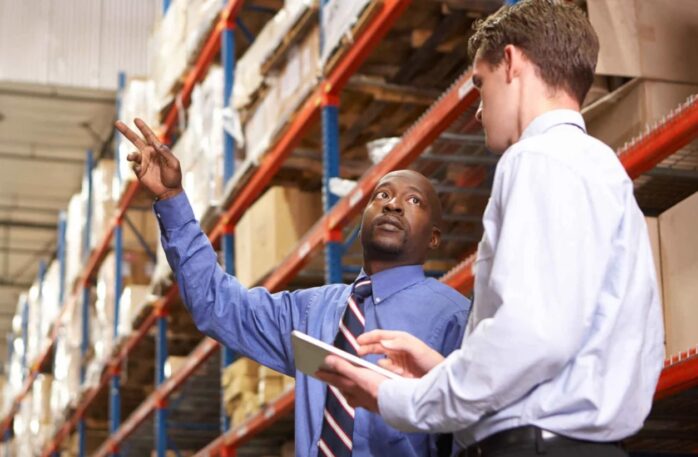African American Man serving as a manager to a warehouse.