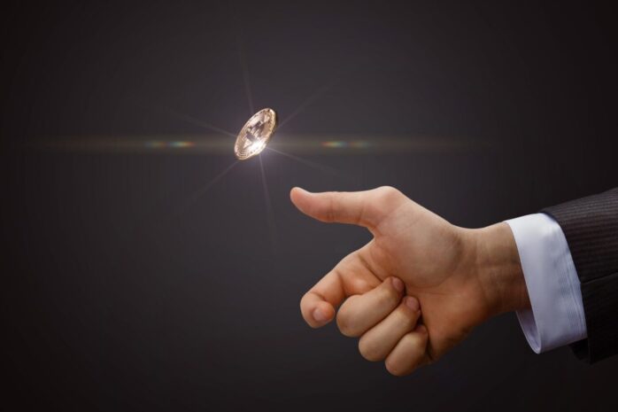 Hand throws a coin