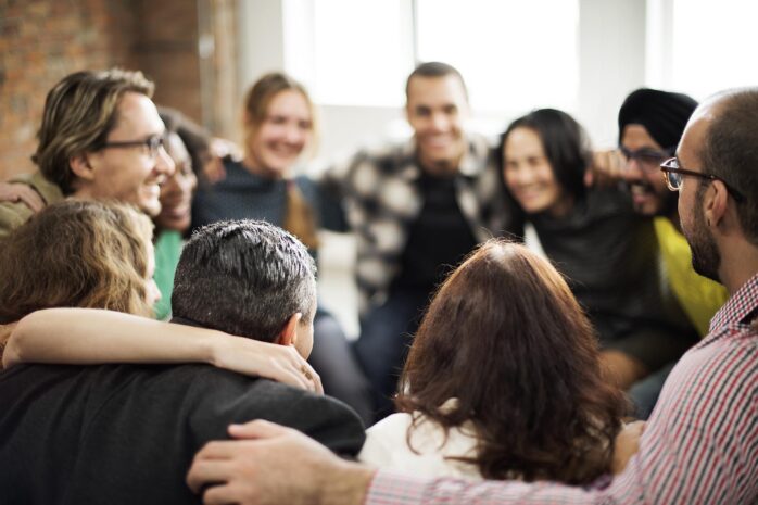 A group of coworkers cheering together.