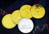 Gold round coins on a black surface