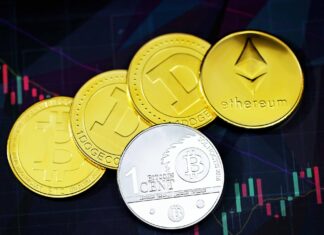 Gold round coins on a black surface