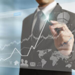 businessman hand writing business graph