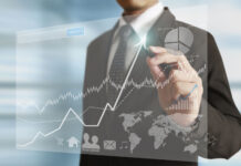 businessman hand writing business graph