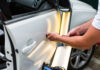 Repairing car dent after the accident by paintless dent repair
