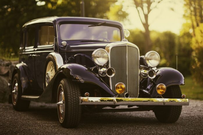 An elegant 1930s station wagon in evening sunlight.