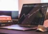 Unlocking Growth Opportunities For Small And Medium Enterprises In The Stock Market (2025) Stock Market Depiction on a laptop