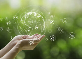 Sustainable development goal (SDGs) concept.Hands holding Global communication network with Environment icon on a green background.Green technology and Environmental technology.ESG