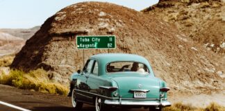 Teal Vintage Car on the road