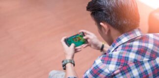 men play game in phone