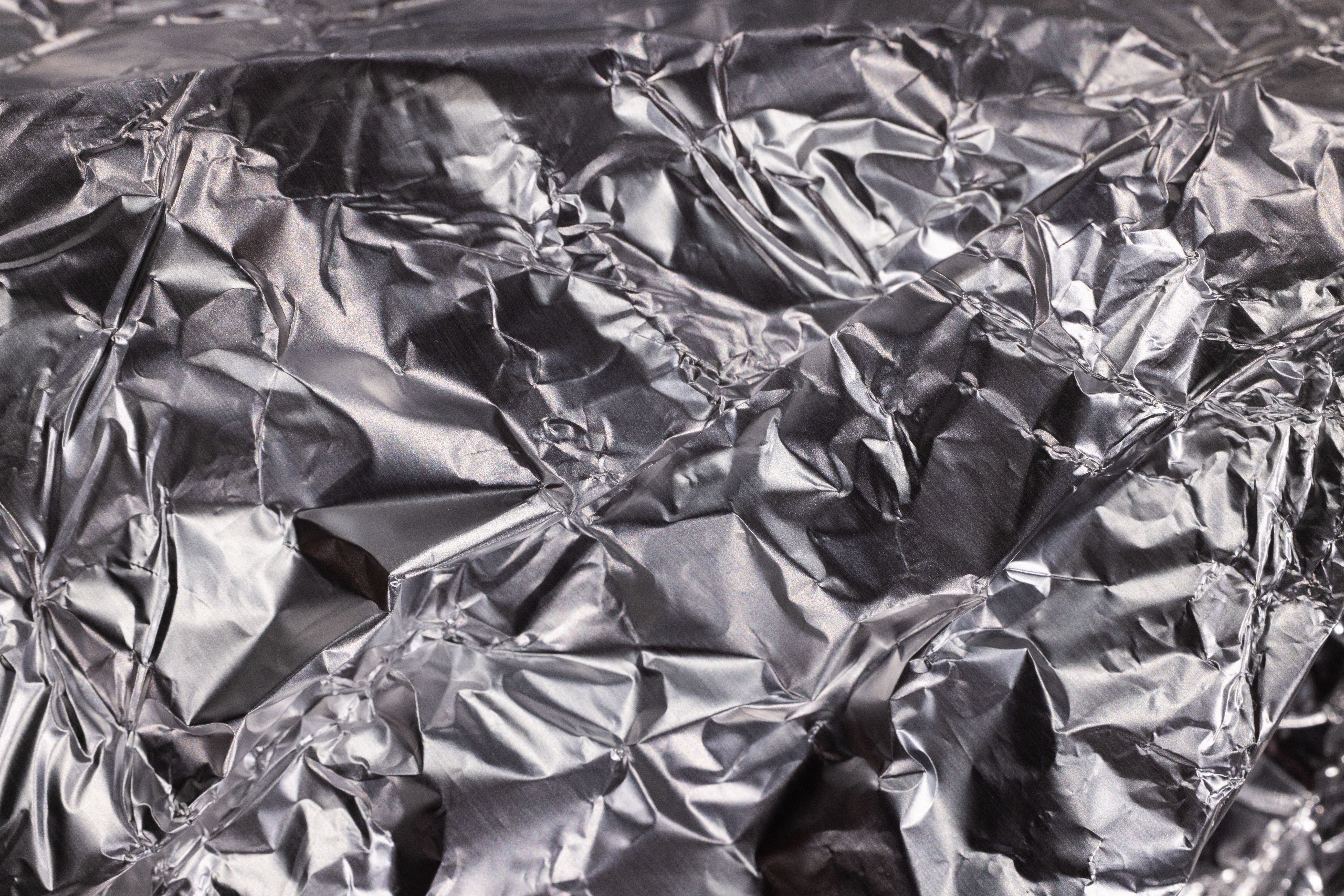 Close-up of shiny metallic foil texture showing the aluminum barrier layer used in Mylar bags