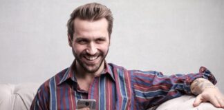 person looking at phone for Online Casino