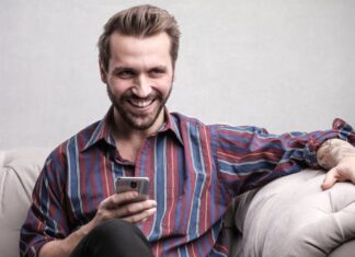 person looking at phone for Online Casino